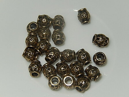 M7116 Metalen kraal 1 st brons rond 6,5x5,5 mm